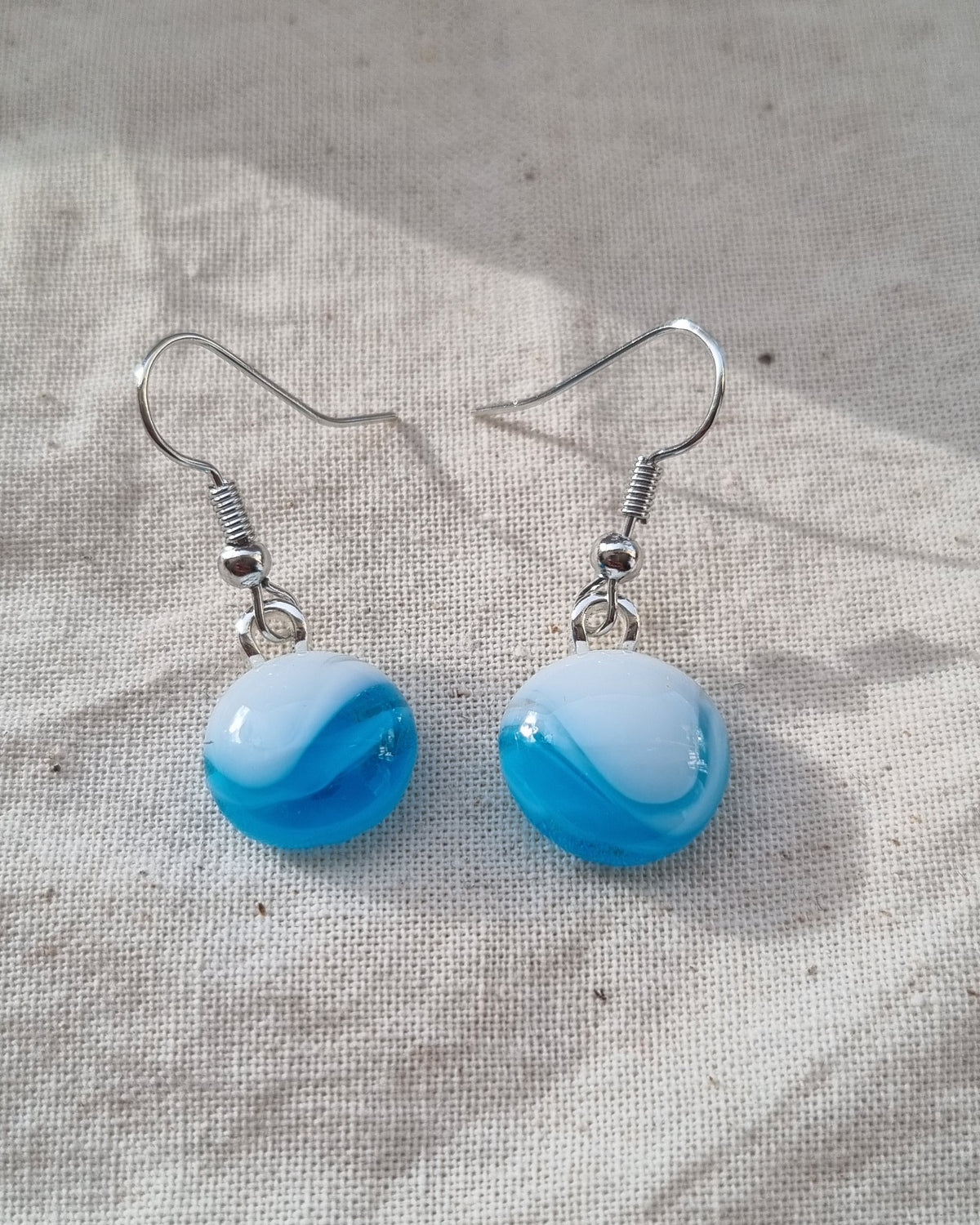 Blue and white handmade glass pebble earrings