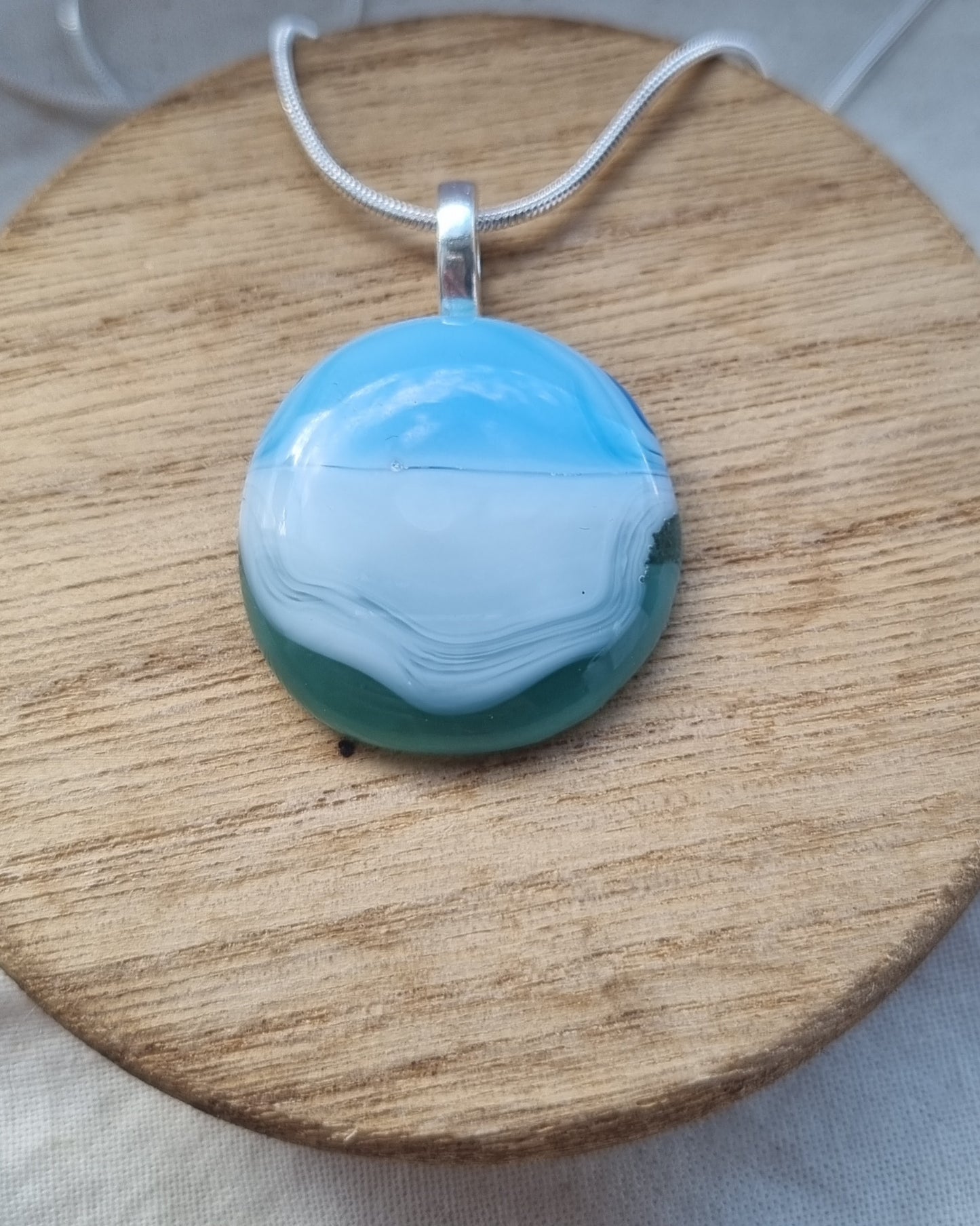 Ocean inspired, blue white and green, handmade glass pebble pendant