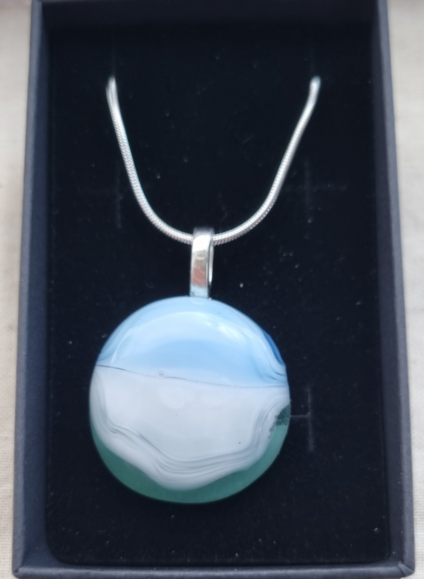 Ocean inspired, blue white and green, handmade glass pebble pendant