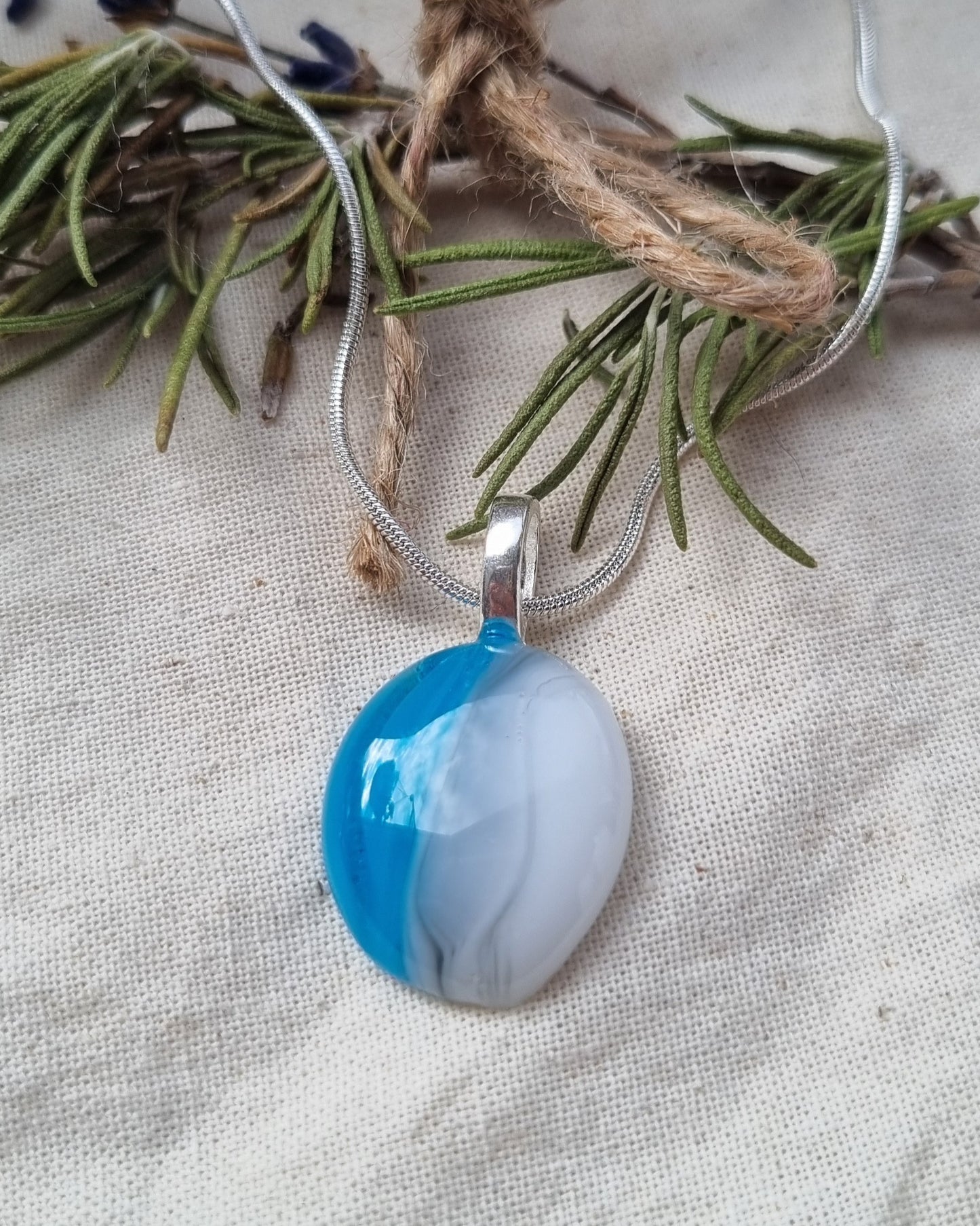 Handmade blue, grey and white glass pebble pendant