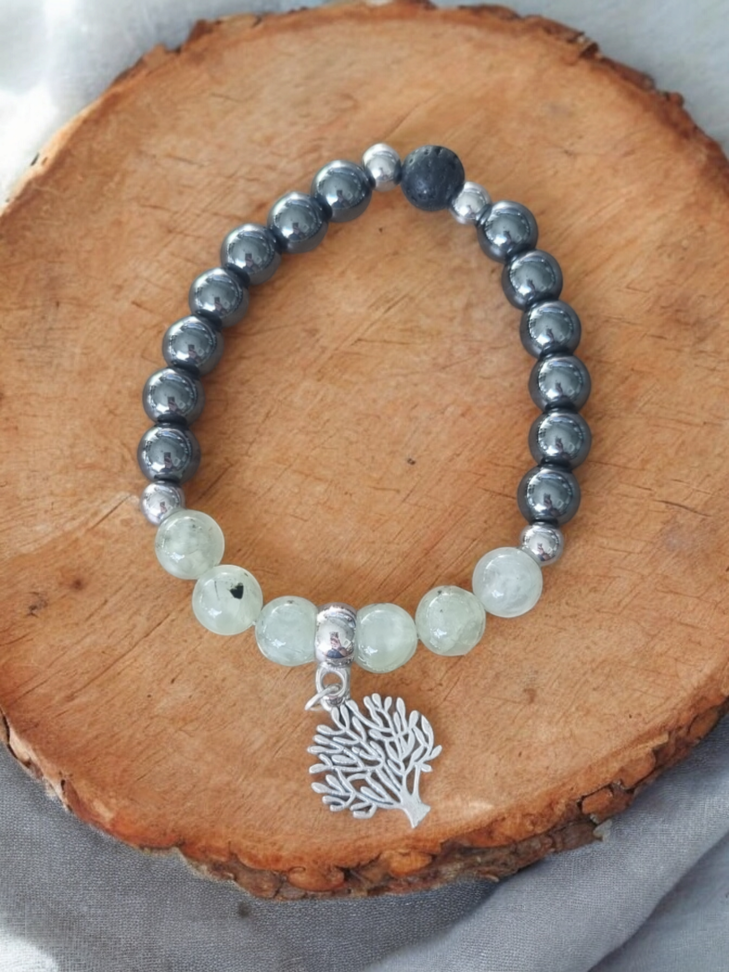 Beautiful natural green prehnite and black Hematite aromatherapy bracelet.