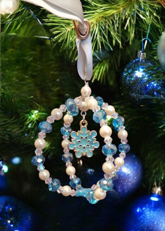 Sparkly handmade Christmas tree decoration, with snowflake charm.