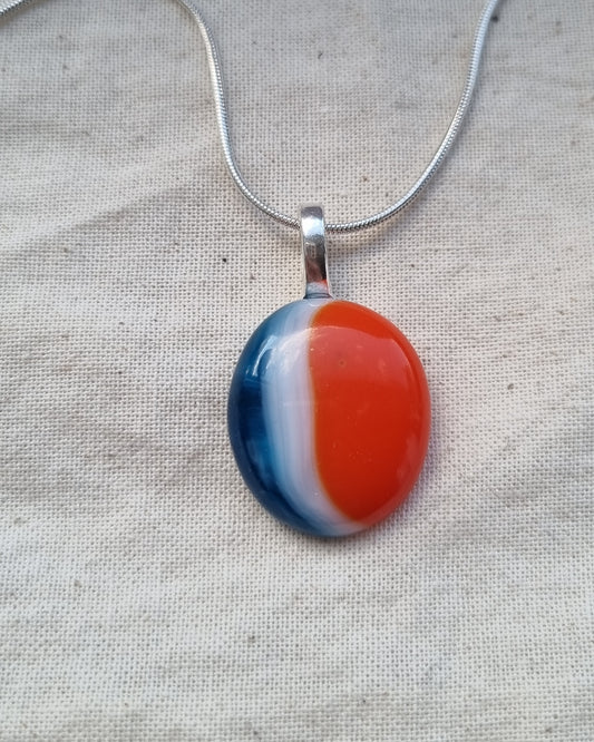 Blue, orange and white, handmade glass pebble pendant.