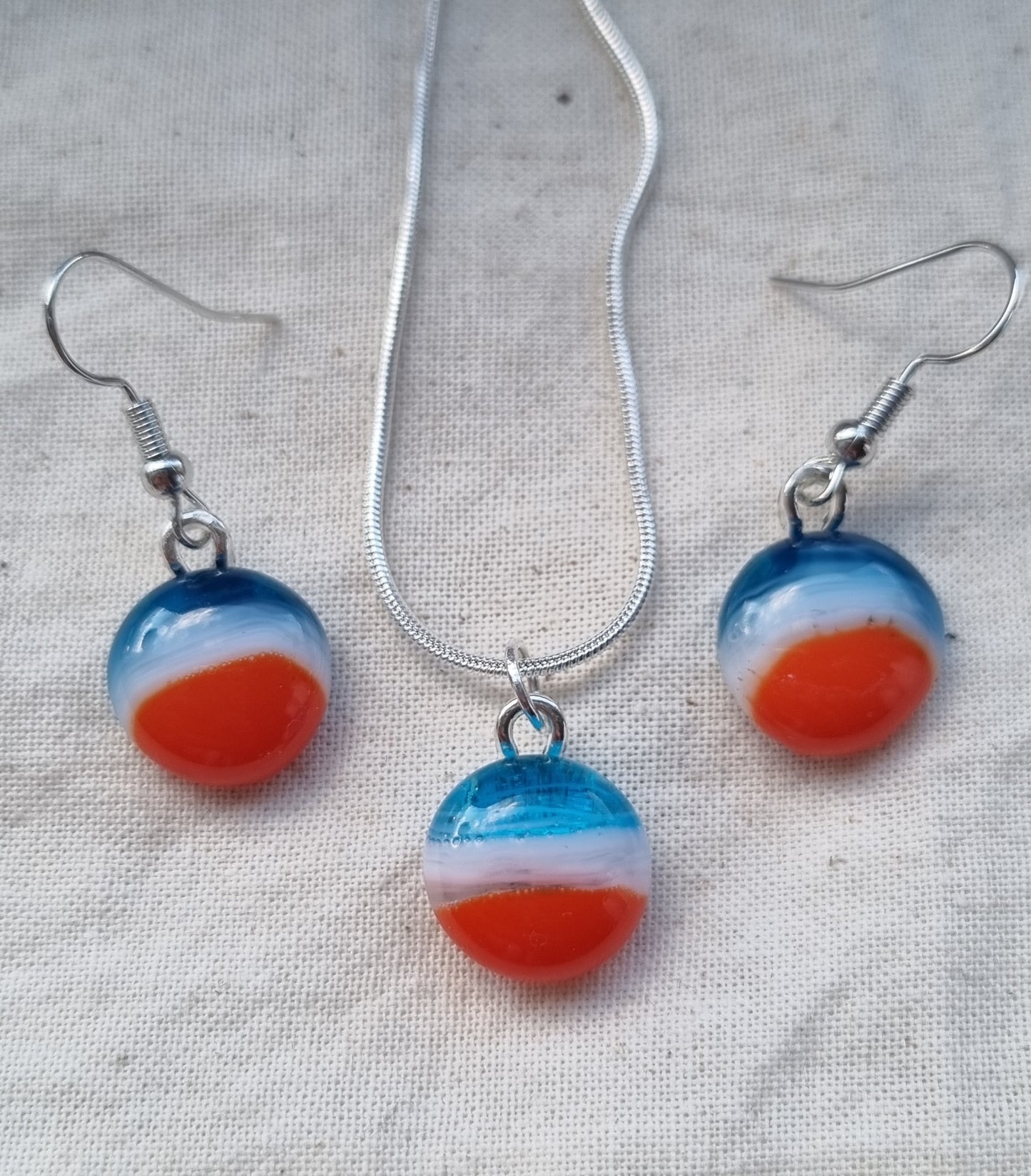 Blue, white and orange handmade glass pebble earrings