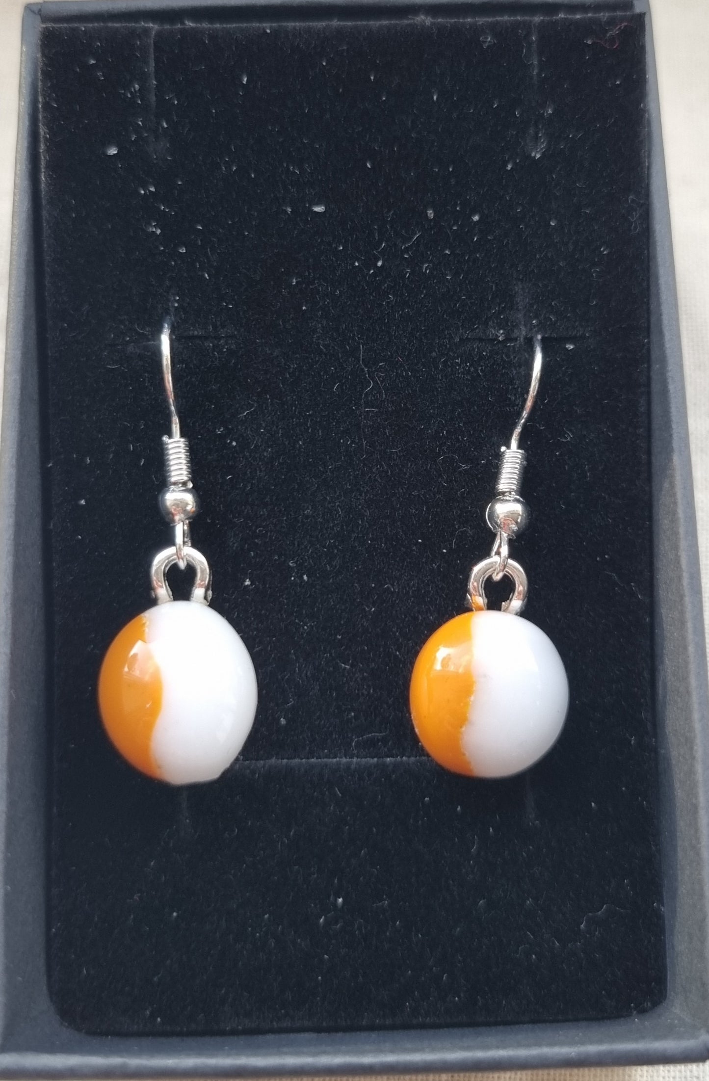 Orange and white, handmade glass pebble earrings
