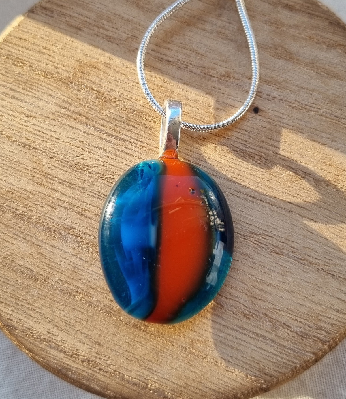 Handmade Blue and orange, glass pebble pendant