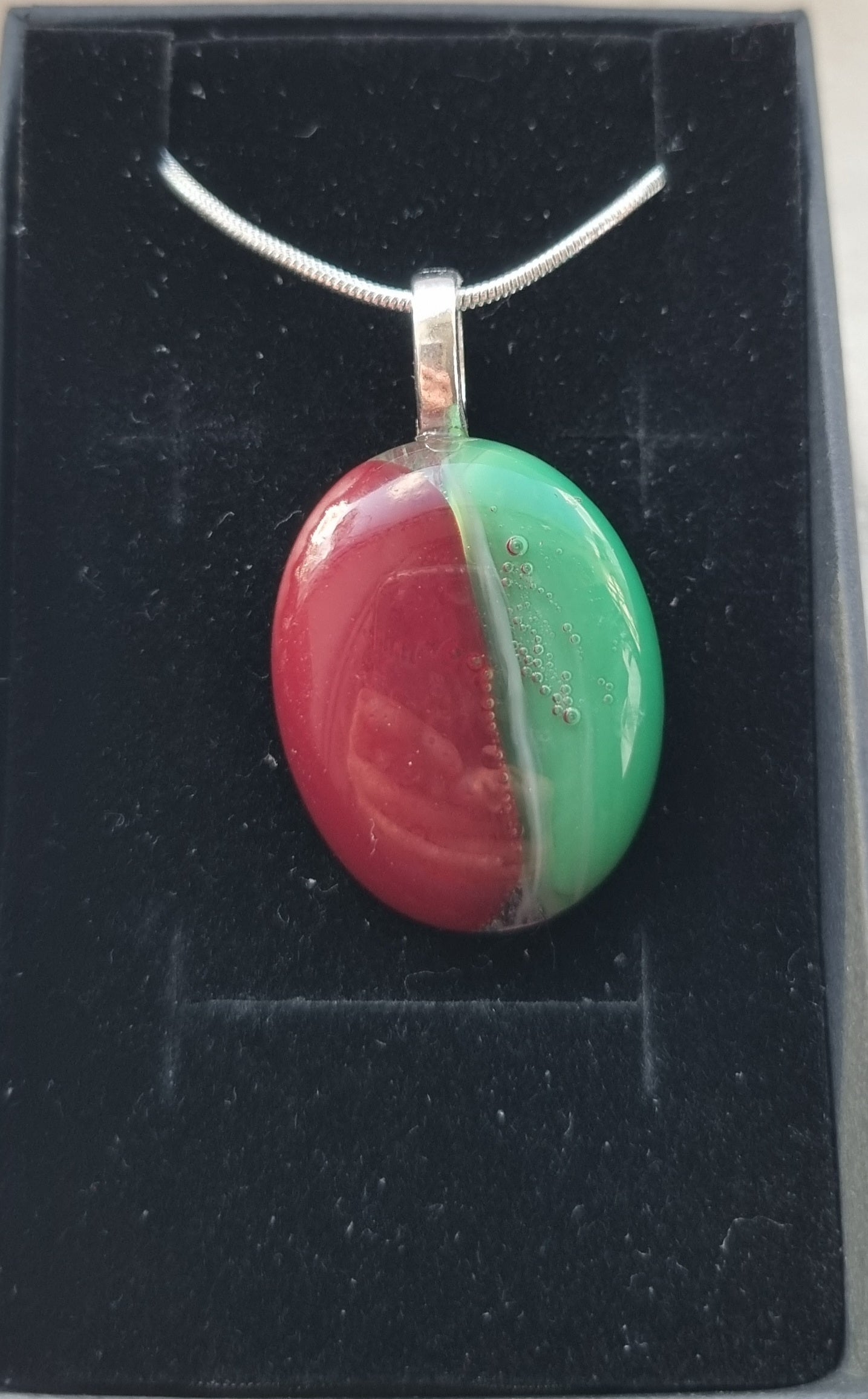 Red and green, handmade glass pebble pendant
