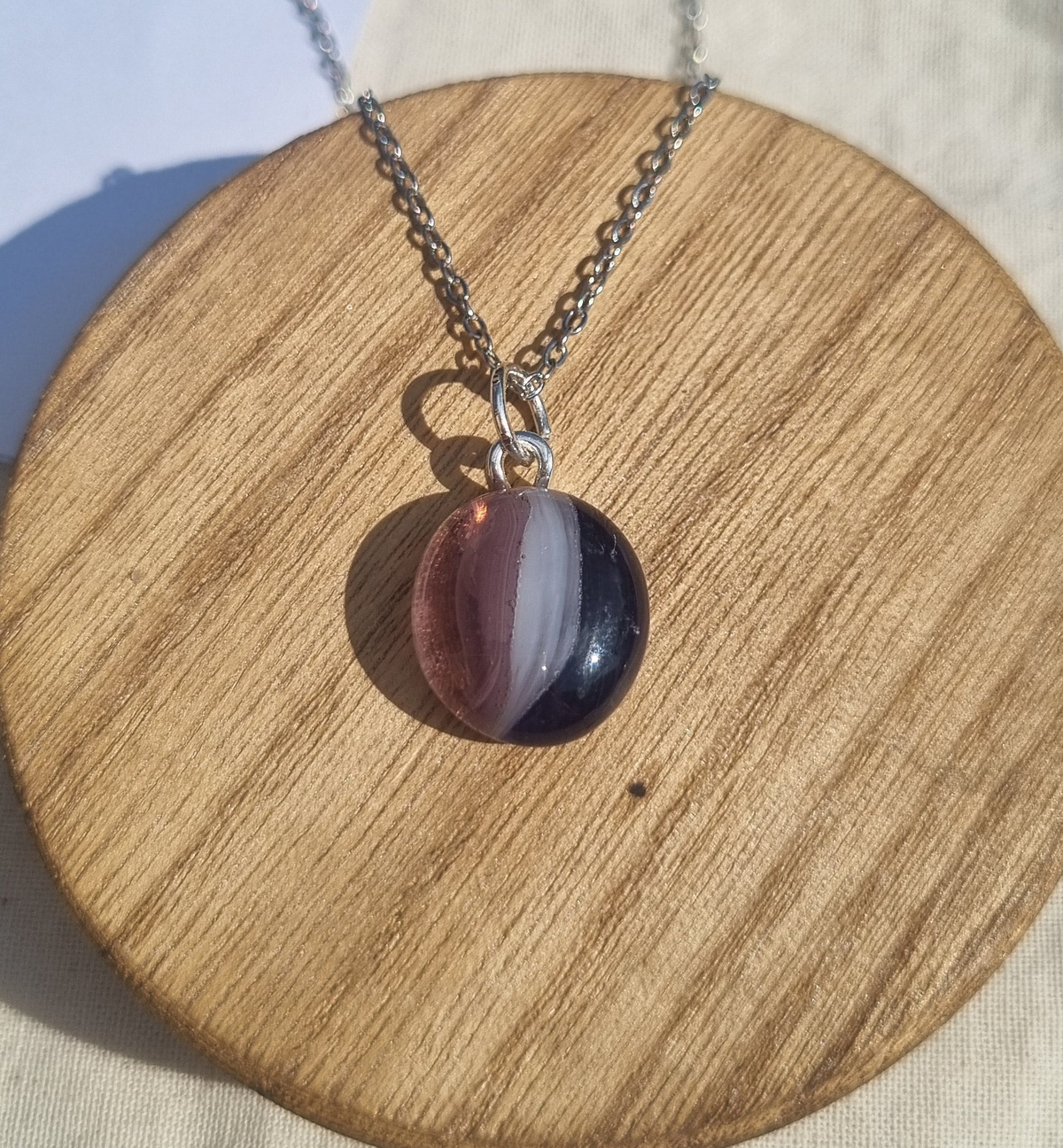 Shades of purple, handmade glass pebble pendant