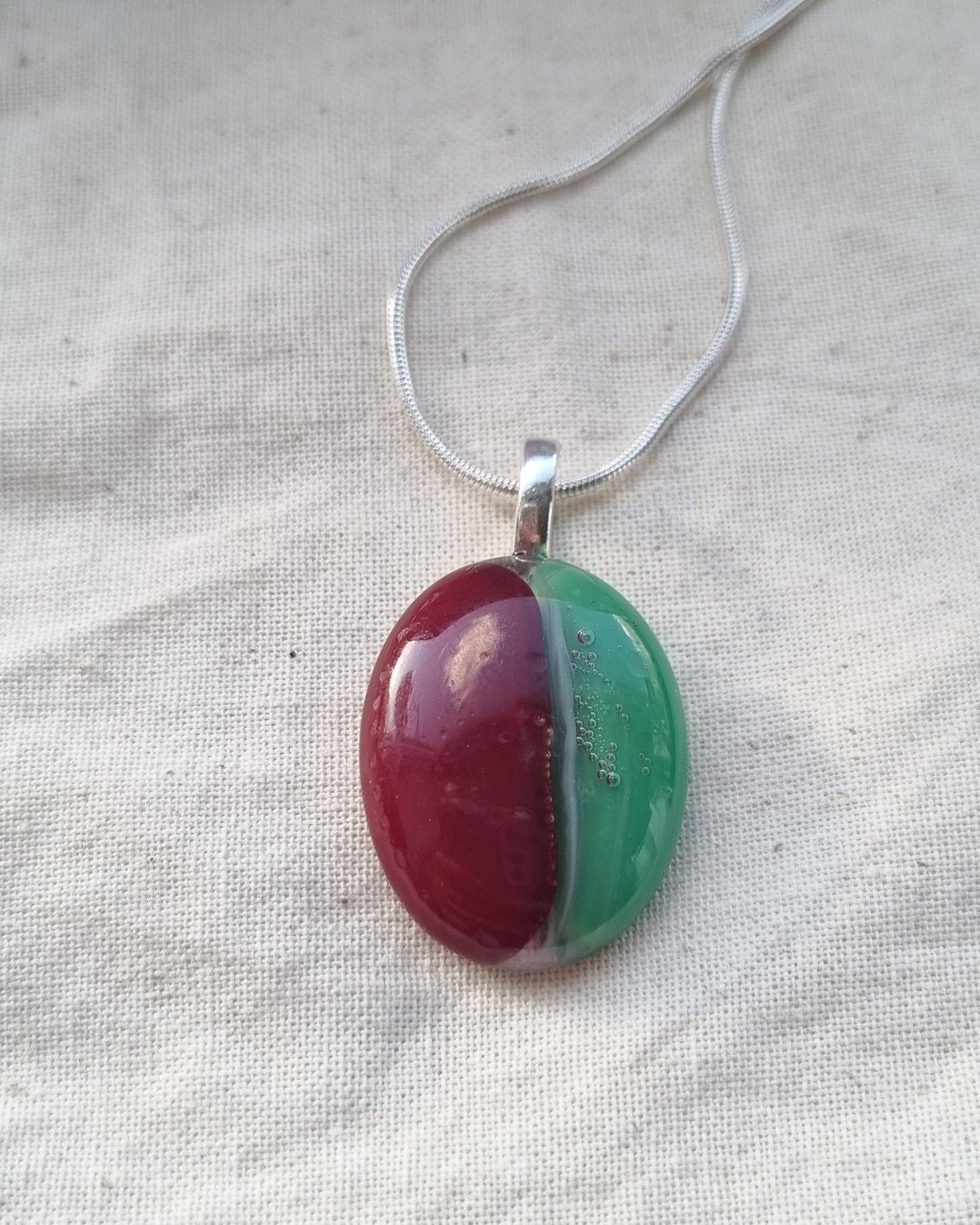 Red and green, handmade glass pebble pendant