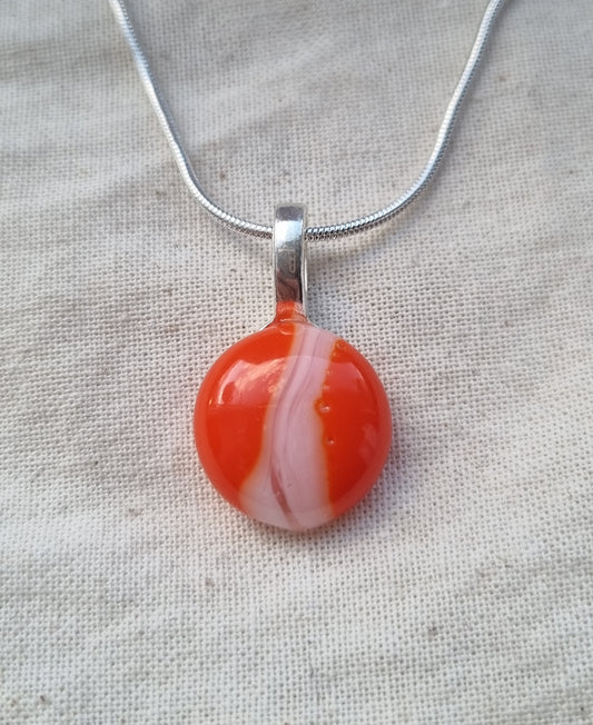 Orange and white, handmade glass pebble pendant